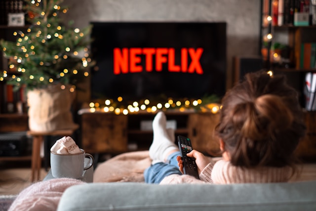 Netflix loading screen on a television in a darkened living room