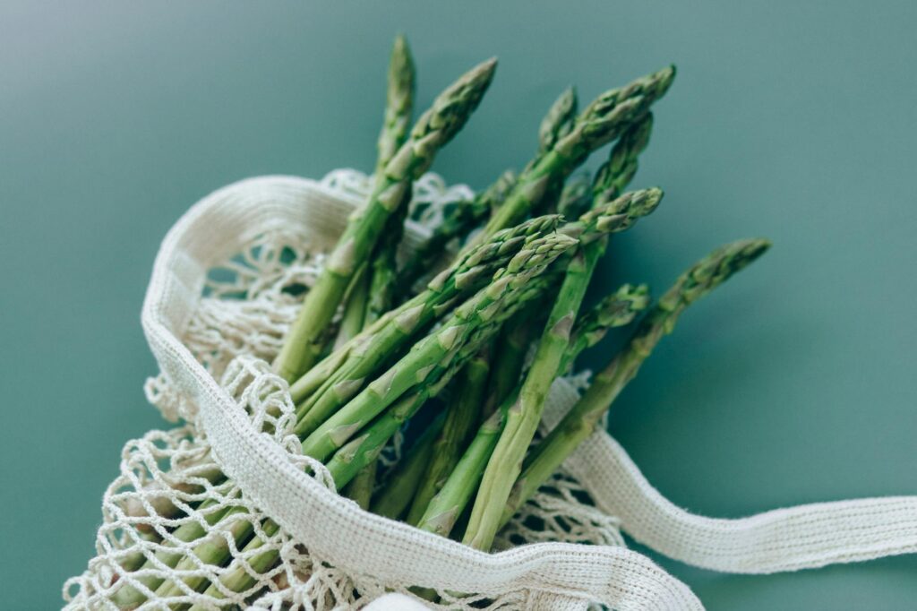 a fresh asparagus on a mesh bag