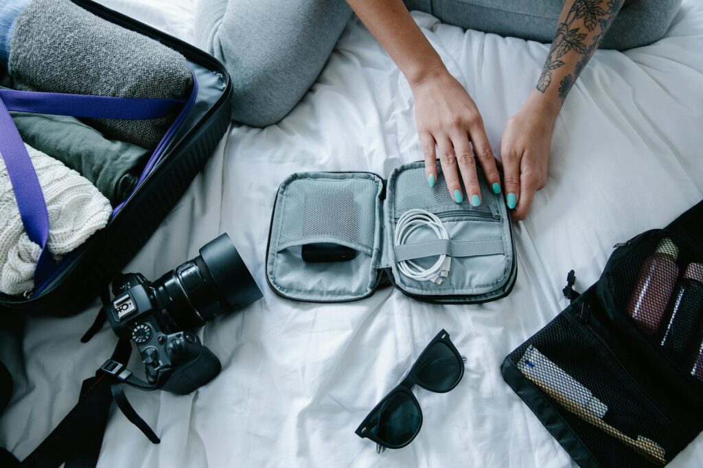 hands on gray bag with cable charger