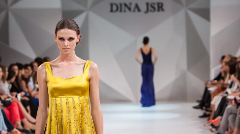 Runway model in tailored shorts illustrating the bermuda shorts UK 2026 trend.