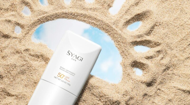 Best daily SPF face cream UK - sunscreen bottle on sand