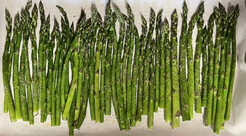 Roasted spears on a baking tray - one of the simplest British asparagus recipes for a spring weeknight.
