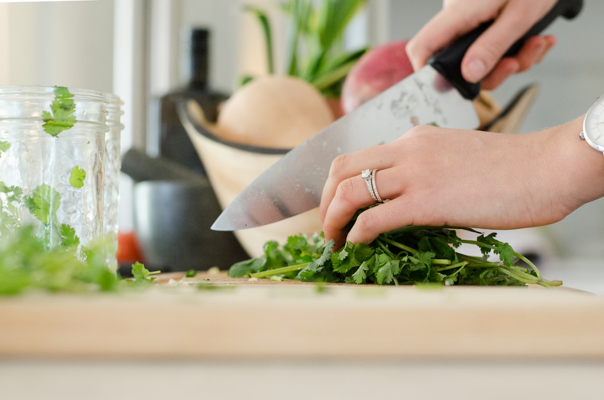 Chopping fresh vegetables for a cabbage dinner recipe