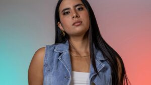 Woman wearing a mid-blue denim waistcoat - the denim waistcoat UK 2026 spring trend.