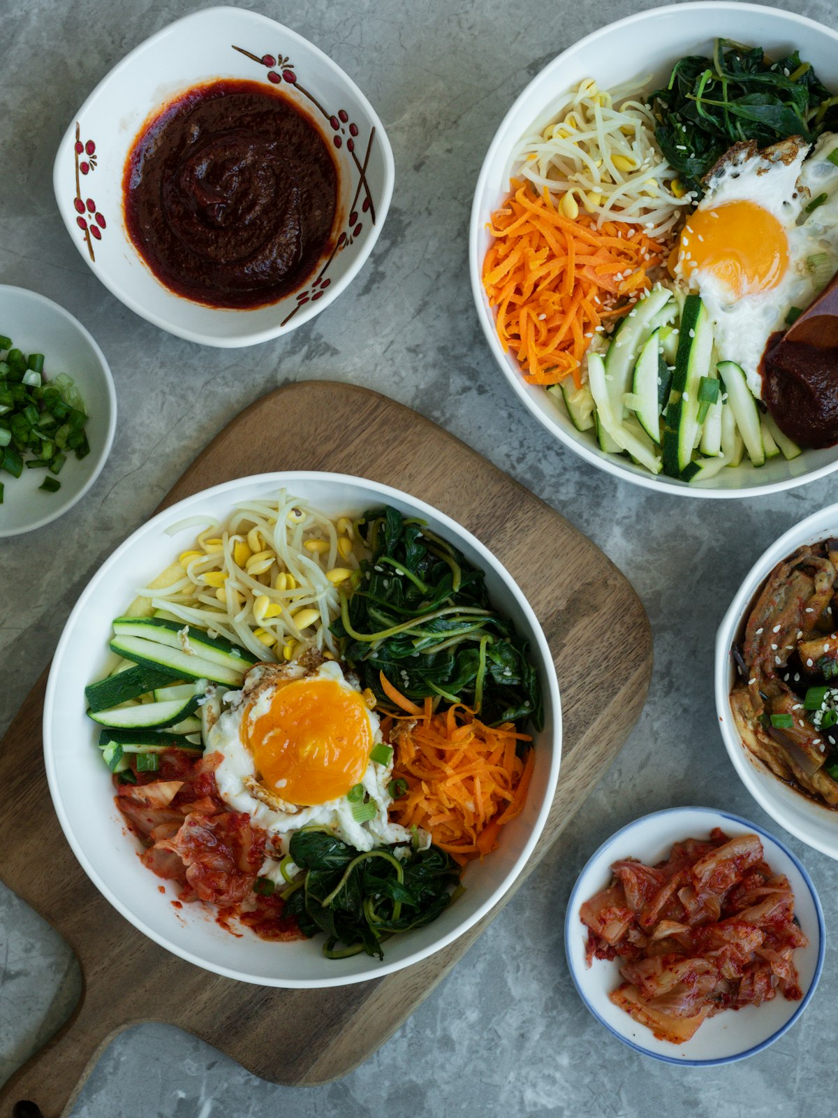 Easy Korean recipes multiple bibimbap bowls with gochujang sauce