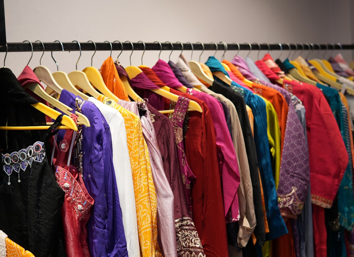 Colourful clothes on a boutique clothing rack - UK high street fashion shopping 2026