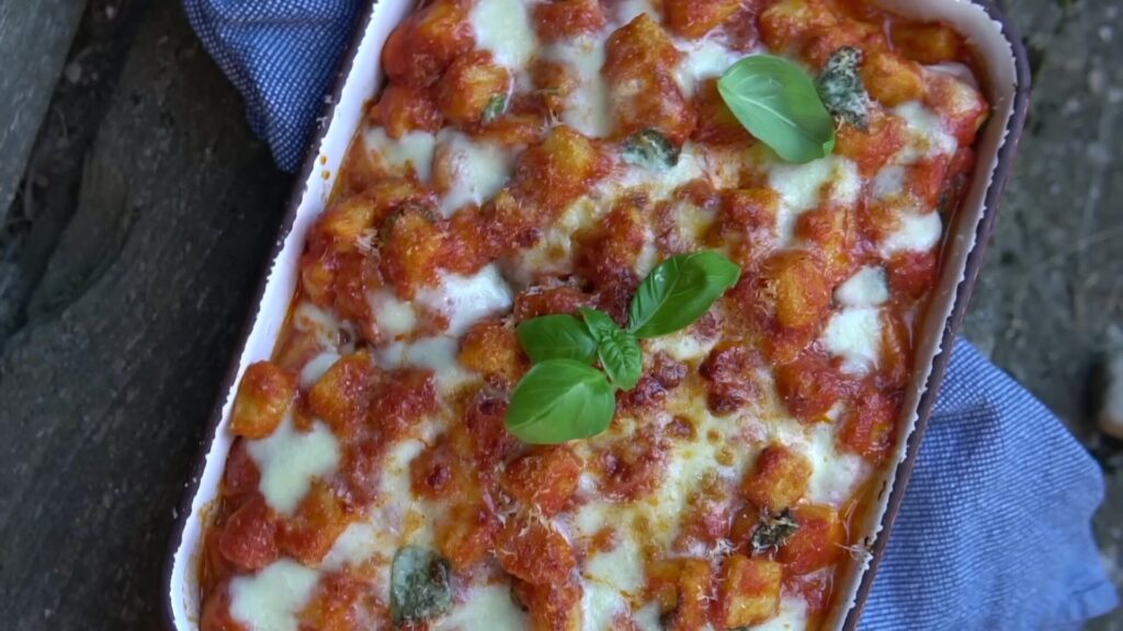 Tray of gnocchi alla sorrentina with melted mozzarella - one of the easiest gnocchi recipes UK weeknight cooks can make in twenty minutes.