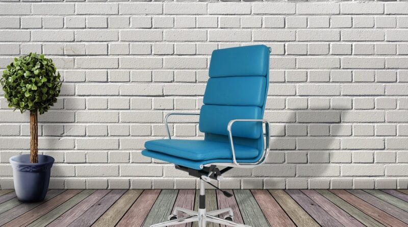 Minimalist home office chair uk 2026 setup with desk and laptop in a bright room