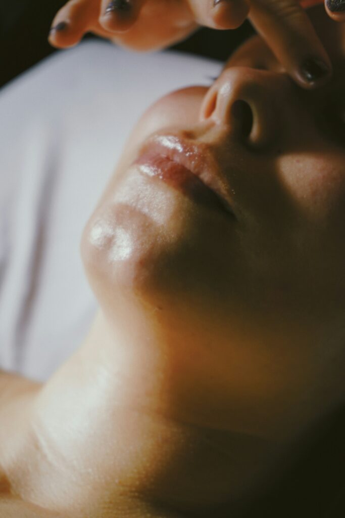 Woman using an LED face mask - best LED face masks UK