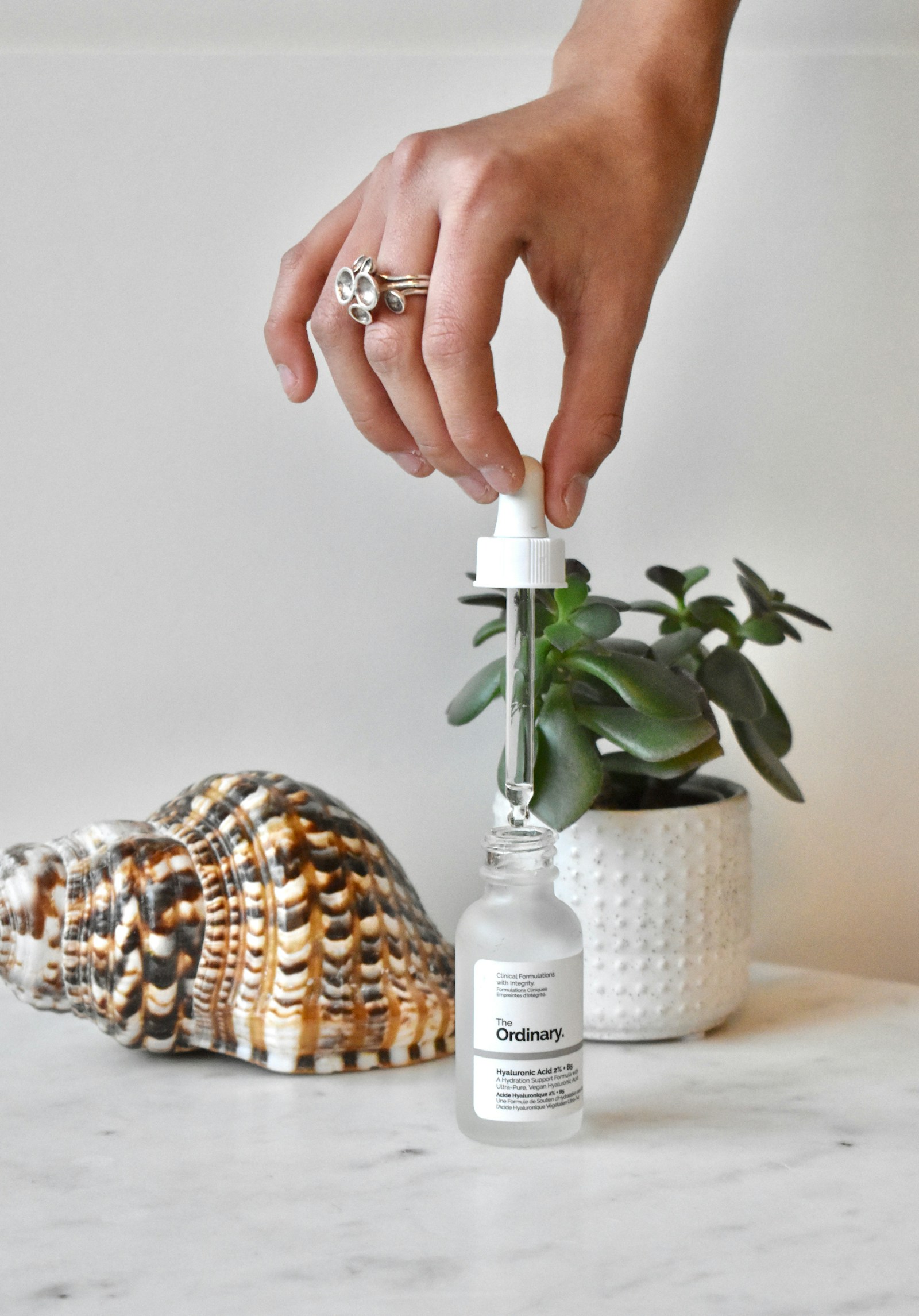 PDRN skincare UK glass bottle on dressing table