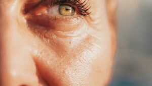 Close-up of mature skin around the eye illustrating a perimenopause skincare concern