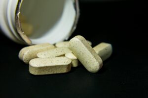 Best magnesium supplements UK 2026 lined up on a dark background