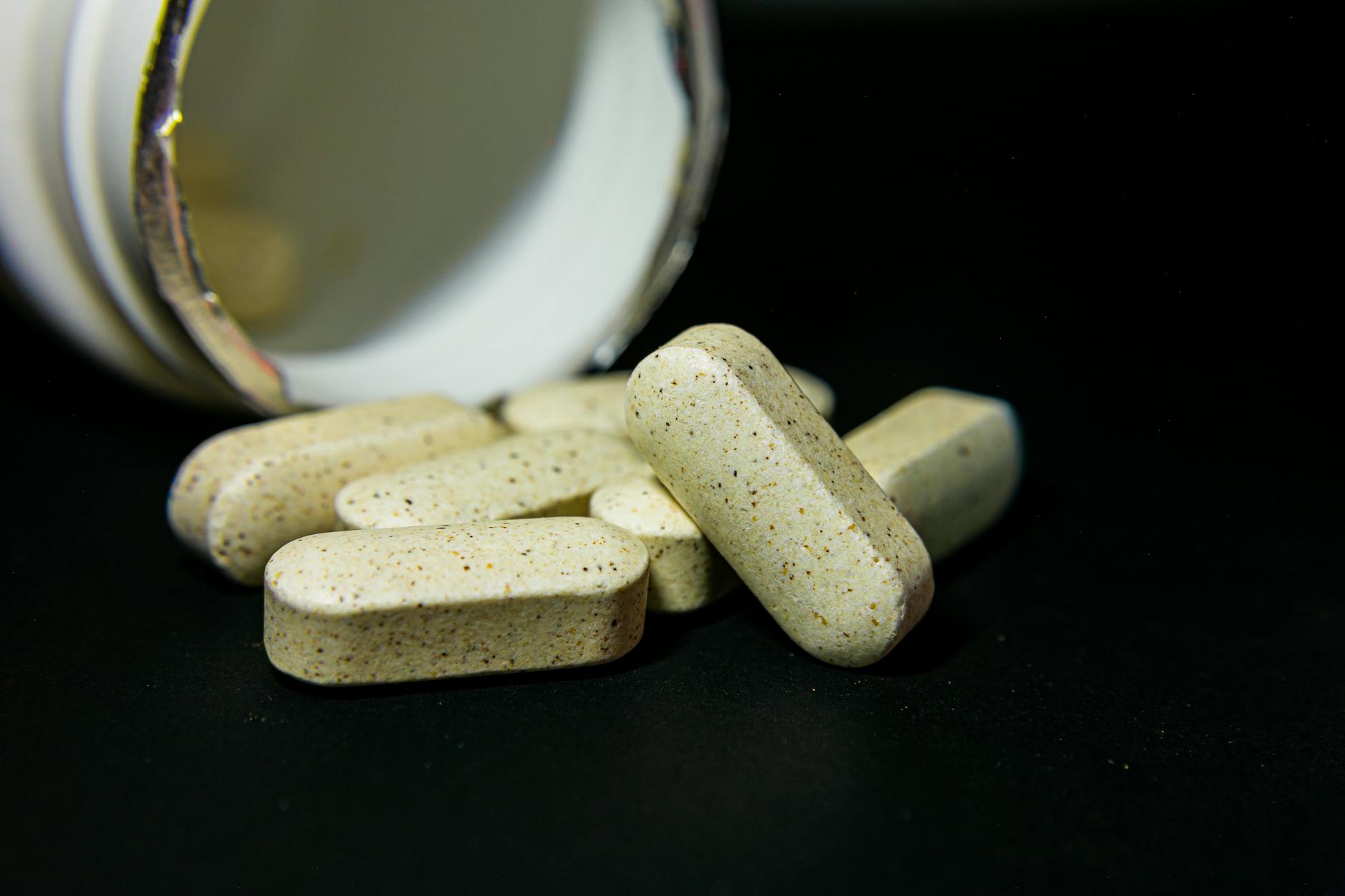 Best magnesium supplements UK 2026 lined up on a dark background