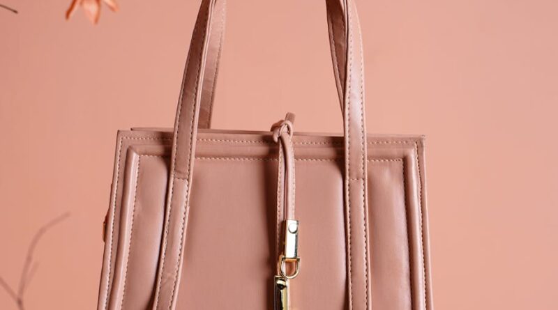 UK handbag trends 2026: blush-pink leather top-handle bag, spring editorial style