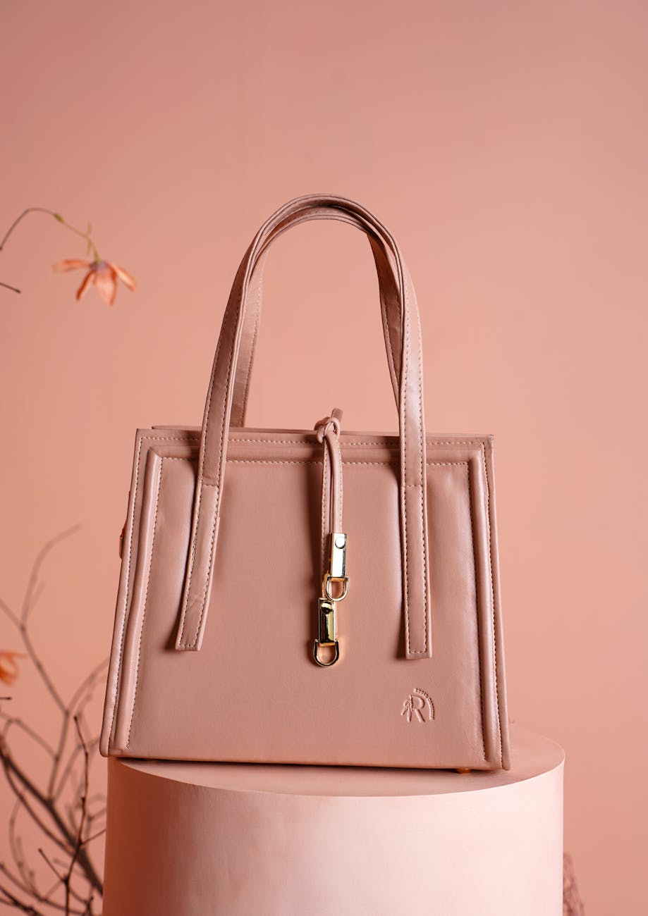 UK handbag trends 2026 - pink leather top-handle bag, spring 2026 style