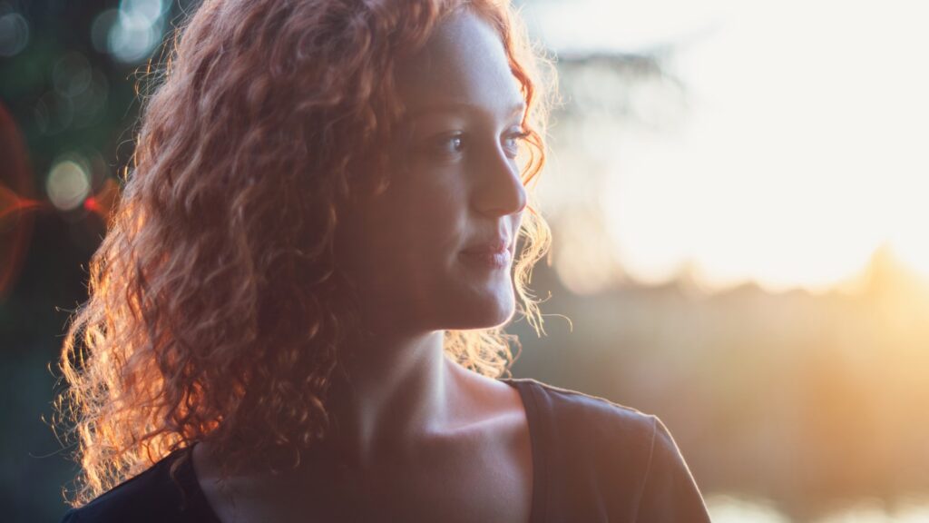 Sunlight on long hair, illustrating why scalp sunscreen UK readers shouldn't skip in summer.