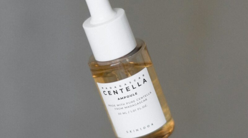 serum dropper bottle with drop of liquid - peptide serum skincare