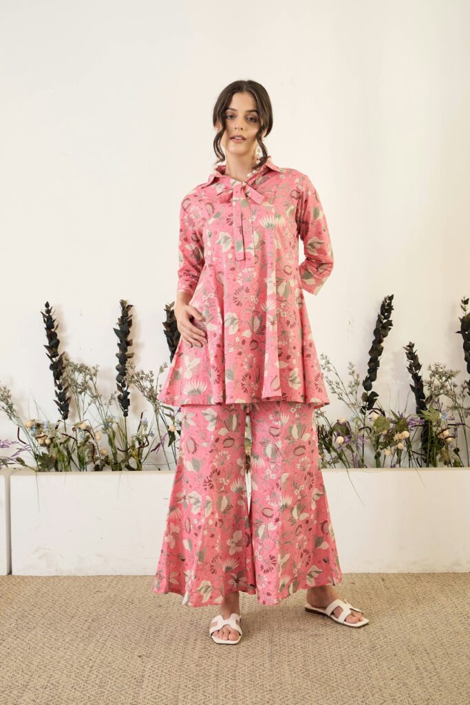 Woman wearing stylish satin trousers for spring 2026