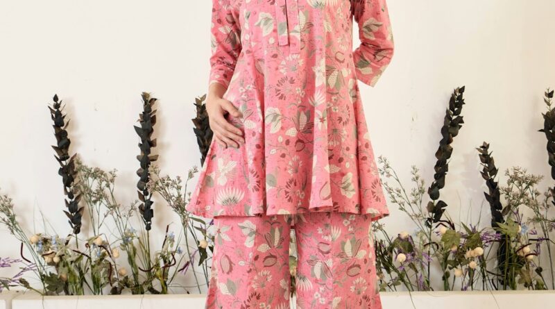 Woman wearing stylish satin trousers for spring 2026