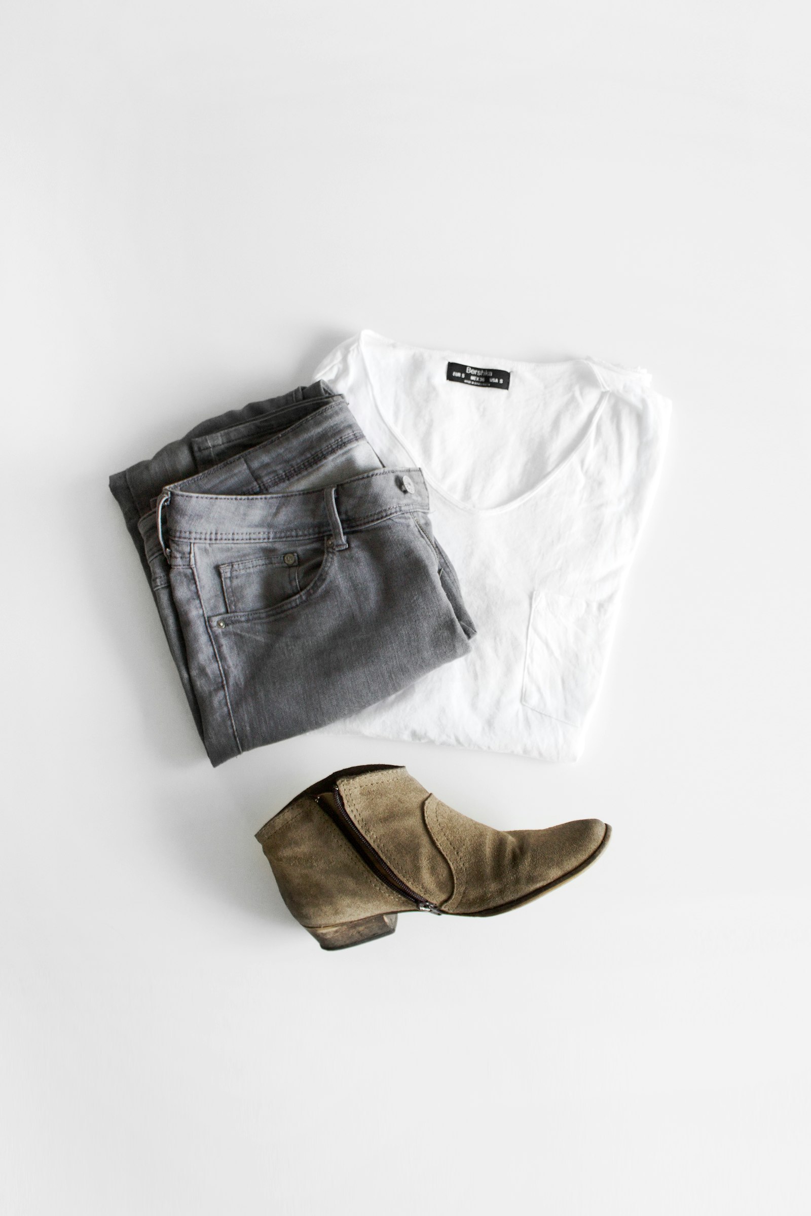 Wide-leg white jeans paired with tan leather boots UK 2026