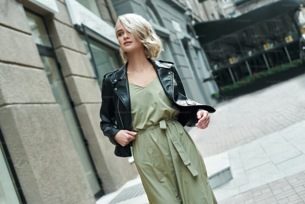 A woman in a smart-casual spring outfit on a city street, illustrating bank holiday outfits UK 2026.