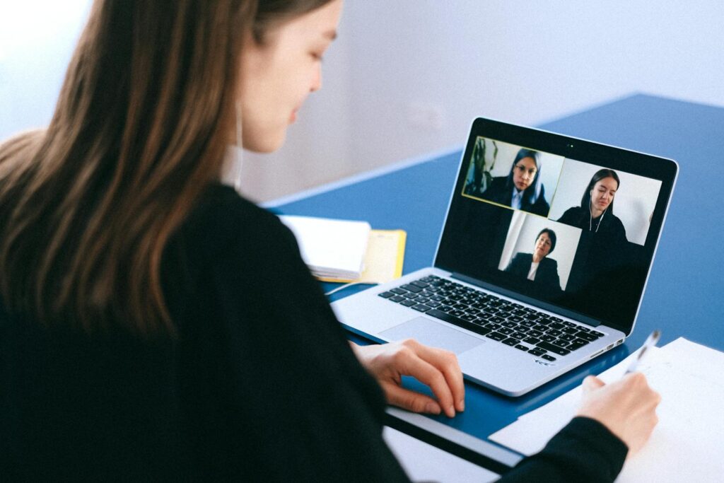A UK home worker on a laptop video call - the moment a built-in laptop camera fails and you wish you had the best webcam for UK home workers.