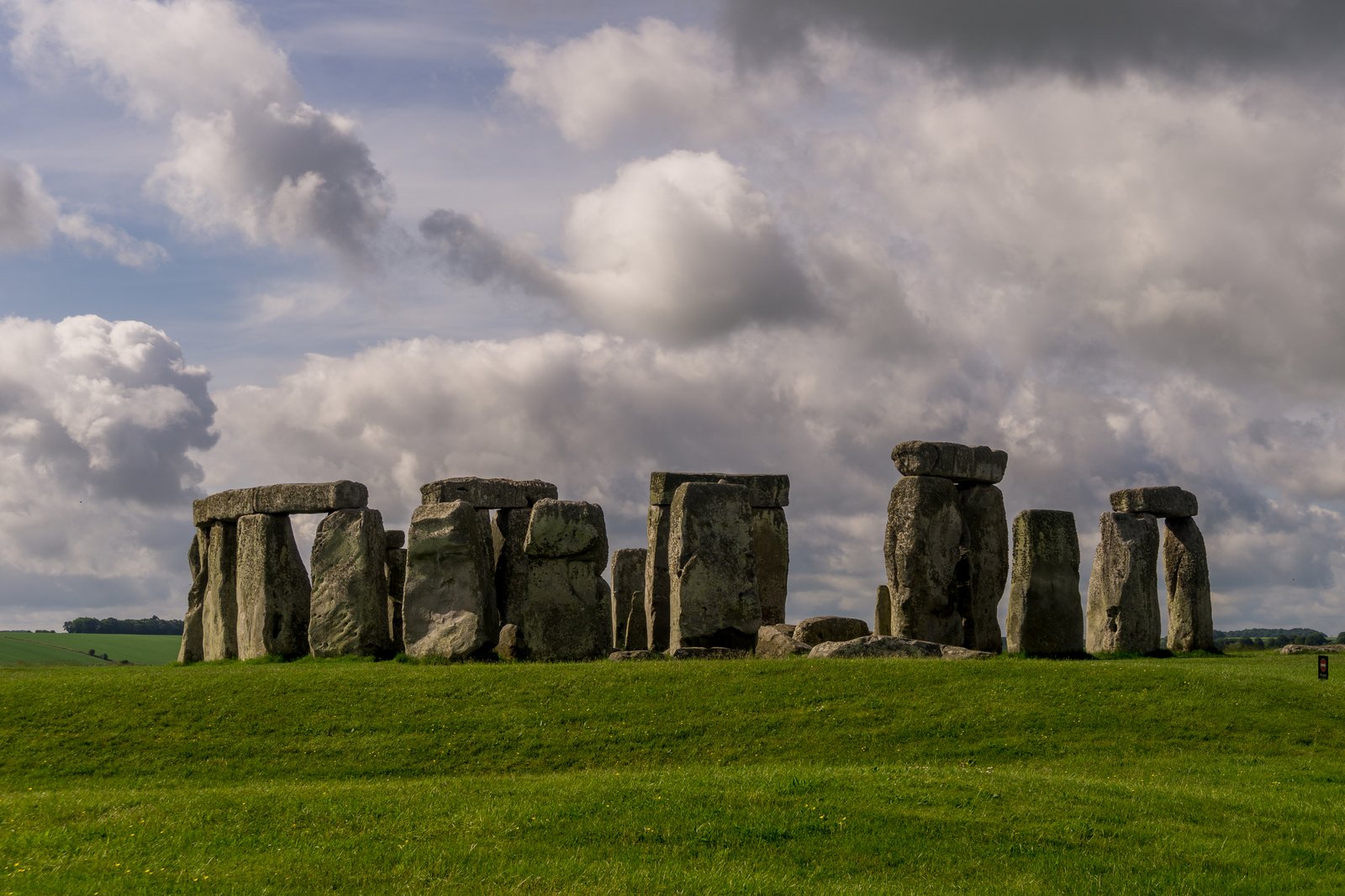Stonehenge under storm cloud, the standing-stone aesthetic British folk horror keeps returning to