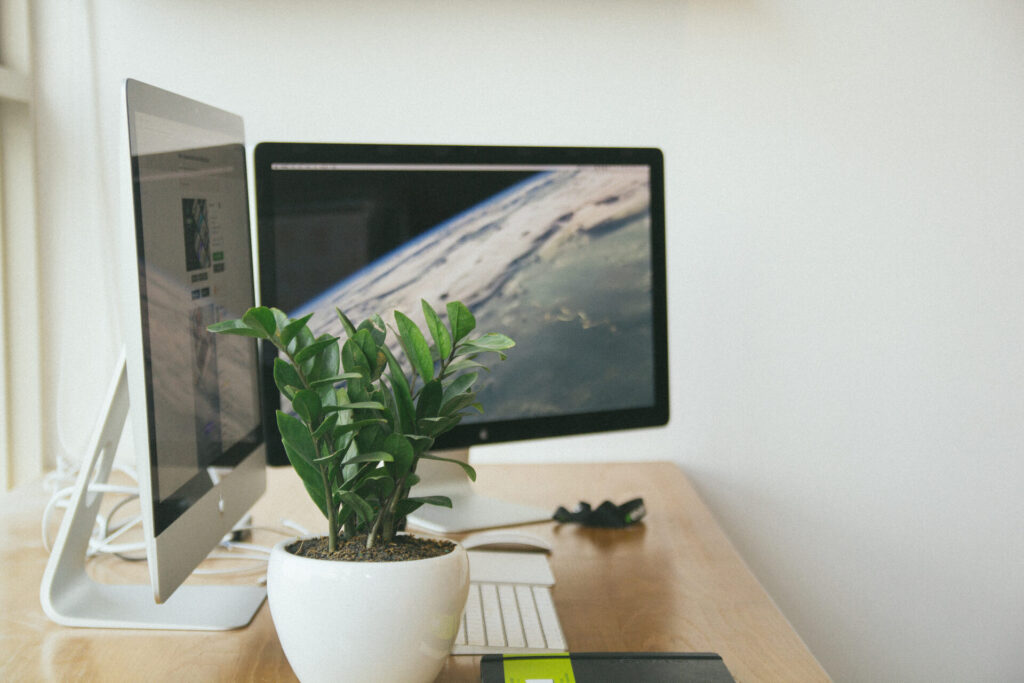Dual monitor setup UK home office with two screens on a wooden desk