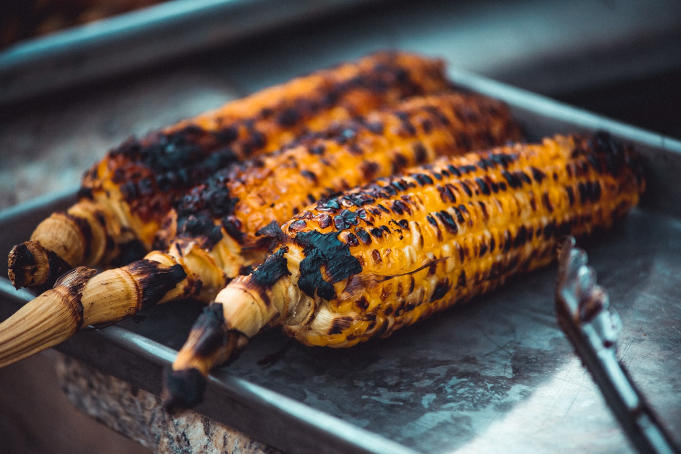 A grilled steak being sliced on a wooden board after cooking on an electric bbq uk 2026