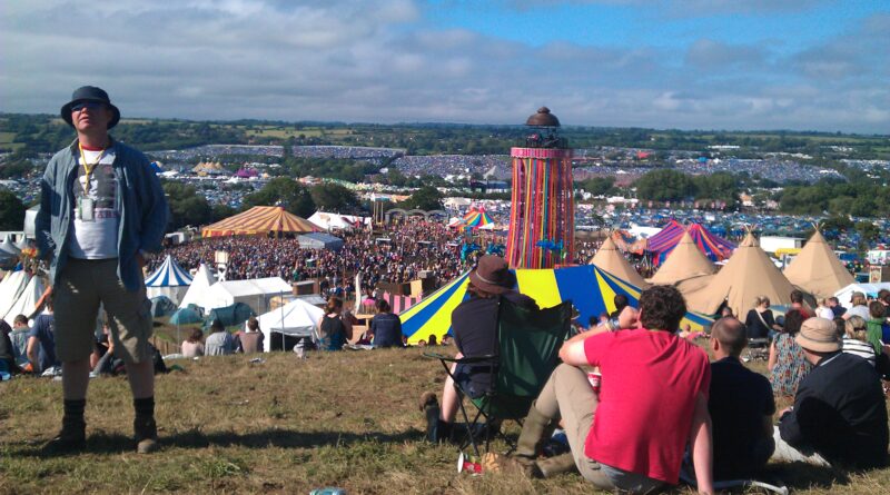 Festival tech essentials UK 2026 in action: crowd gathers at a UK summer music festival with phones and portable gear visible.