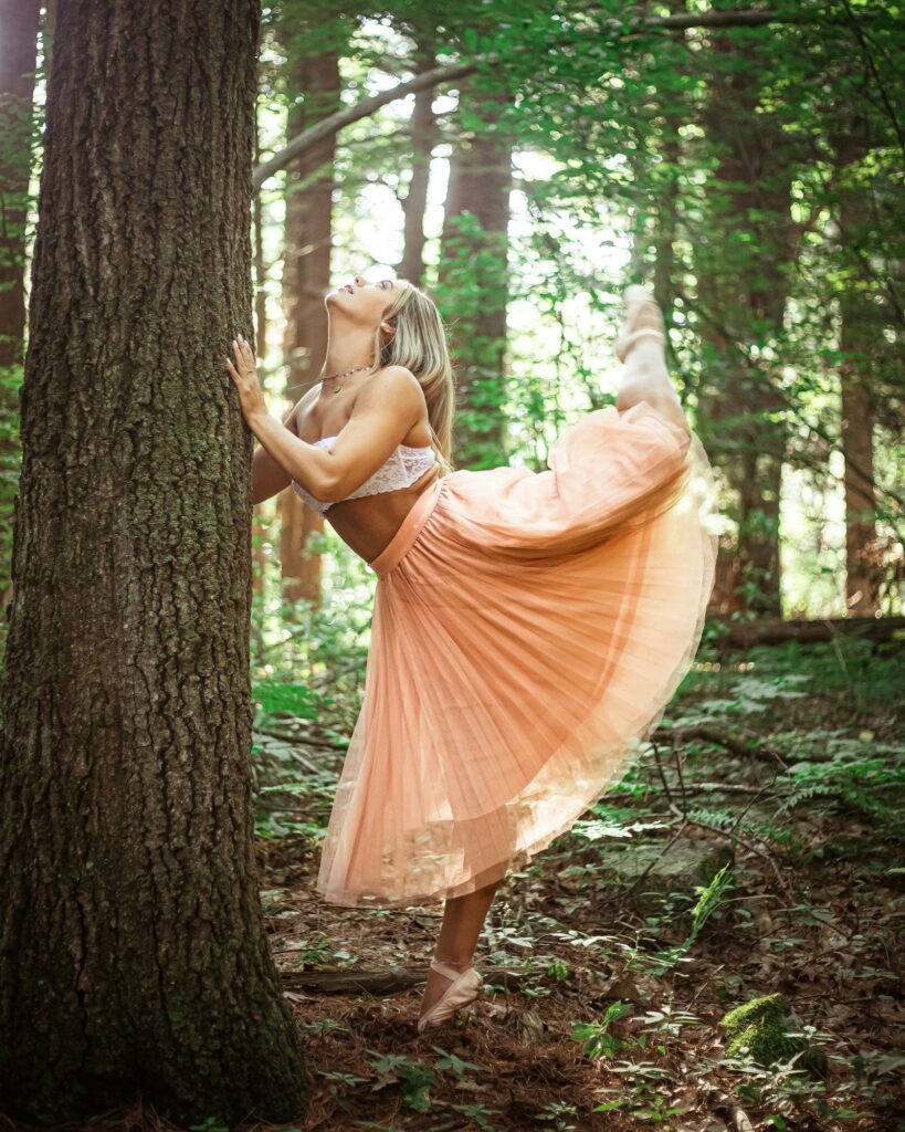 A summer maxi skirt outfit UK editors are wearing - long pink skirt with white crop top, photographed outdoors.