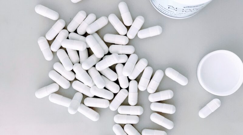 White supplement capsules representing myo-inositol for PCOS, taken twice daily by UK women managing the condition in 2026.