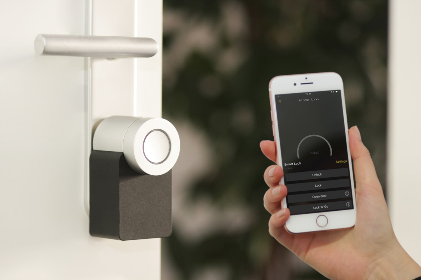 Smartphone unlocking a flat door with a Matter-compatible smart lock