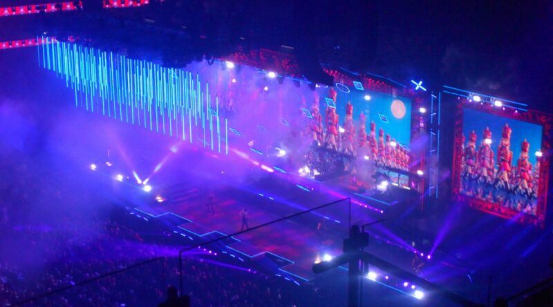 Concert stage lit in blue, evoking the UK Eurovision 2026 result and the production scale Britain is now competing against.