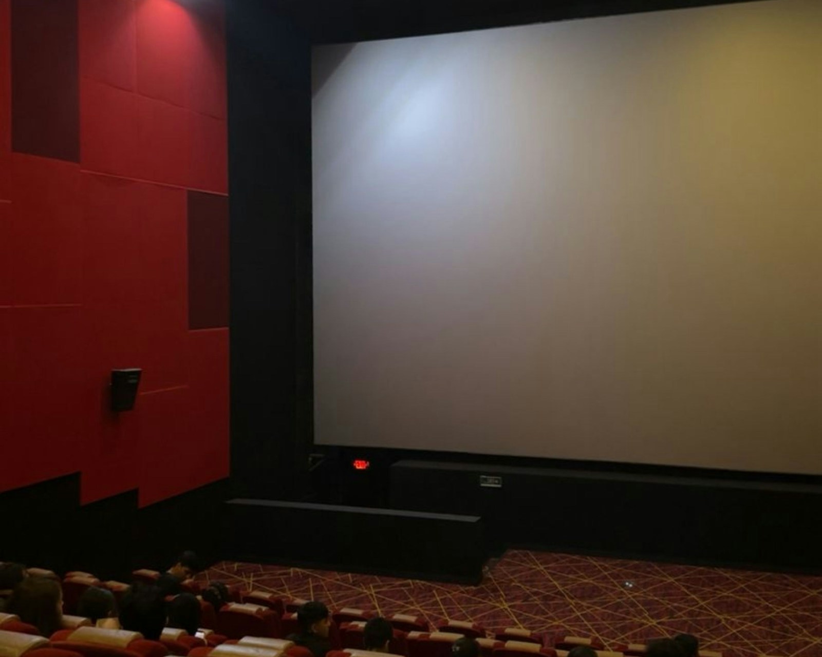 A waiting cinema screen before a screening, the quiet daily reality behind UK indie cinemas in 2026