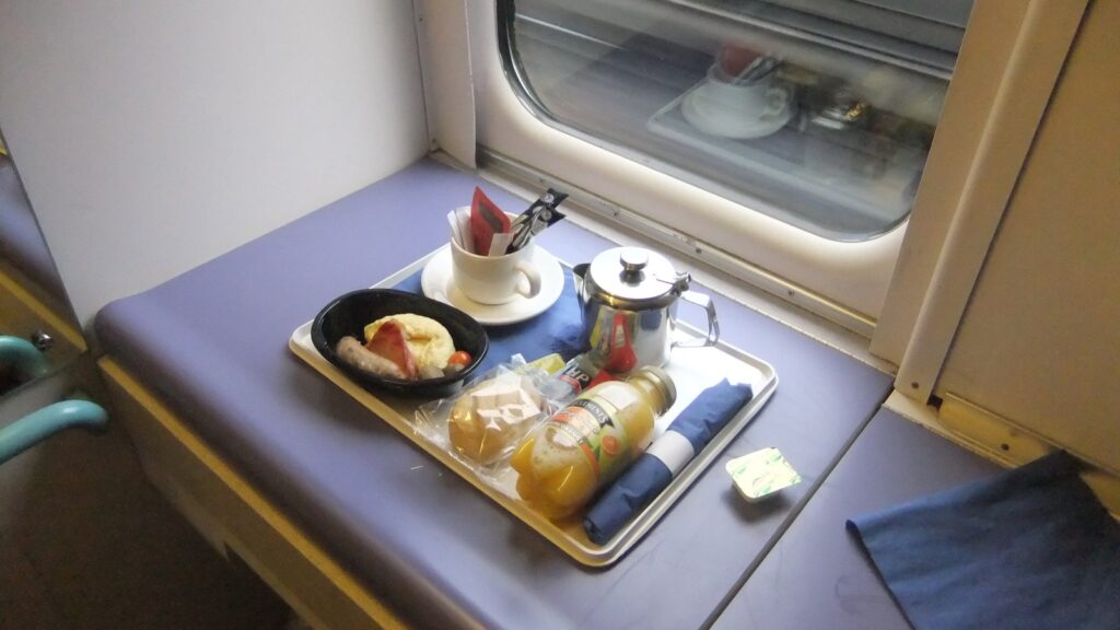 A Caledonian Sleeper train at a UK station - UK sleeper train holidays 2026