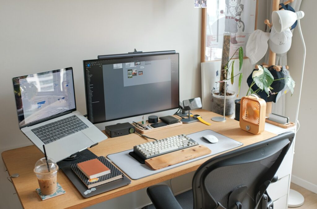 A tidy hybrid working desk with a laptop, monitor and a USB-C docking station for a UK home office in 2026.