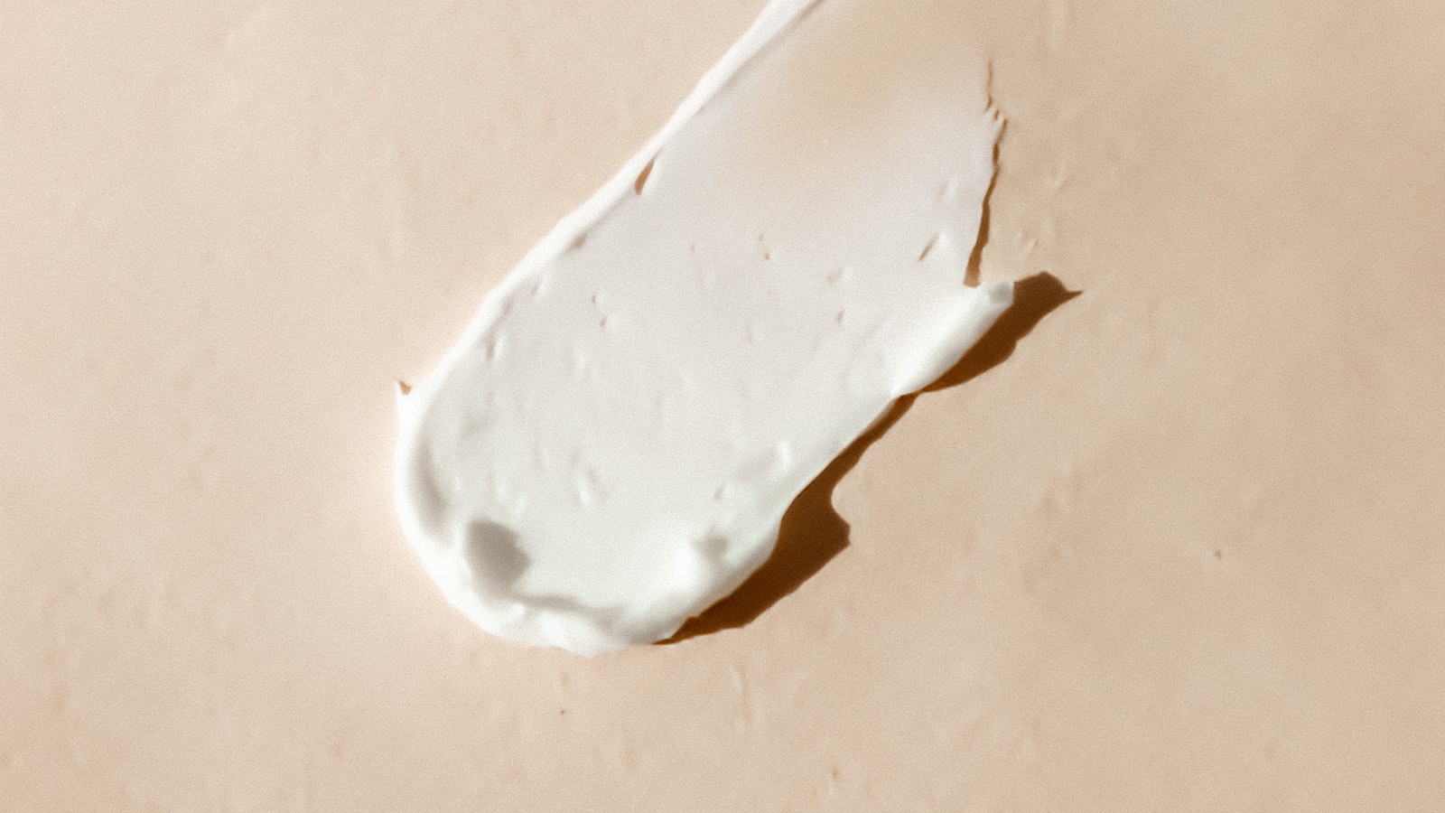 Cream texture swatch representing a simple, gentle rosacea routine