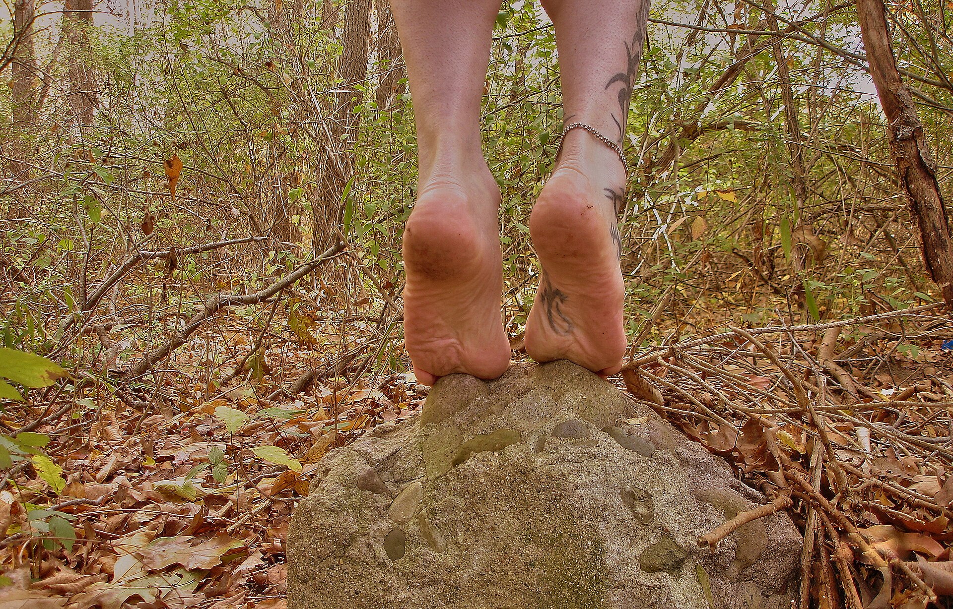 Bare feet flat on the floor, the kind of natural foot position barefoot shoes are designed to allow