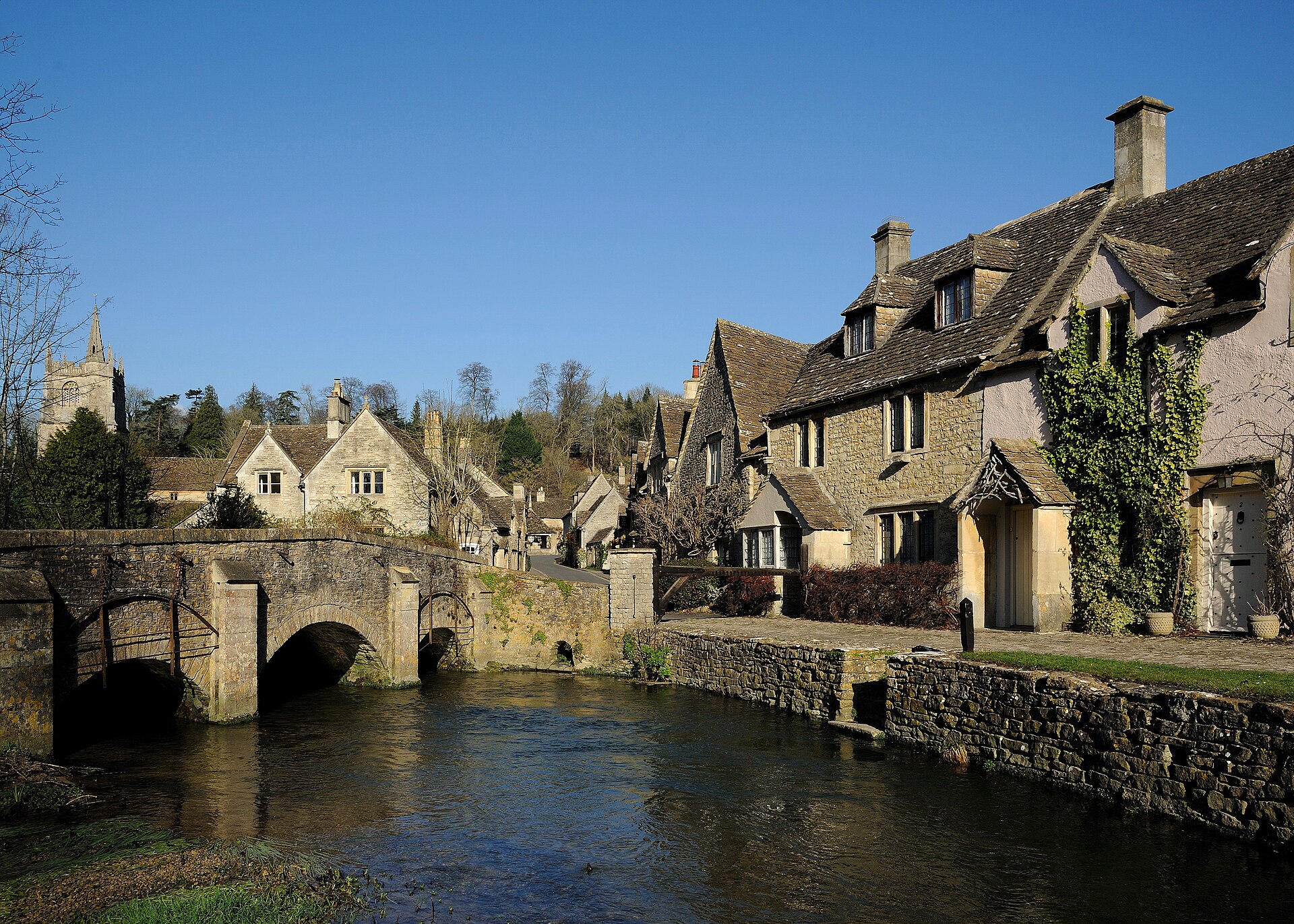 An idealised English village by a river - the archetypal setting that defines cosy crime 2026