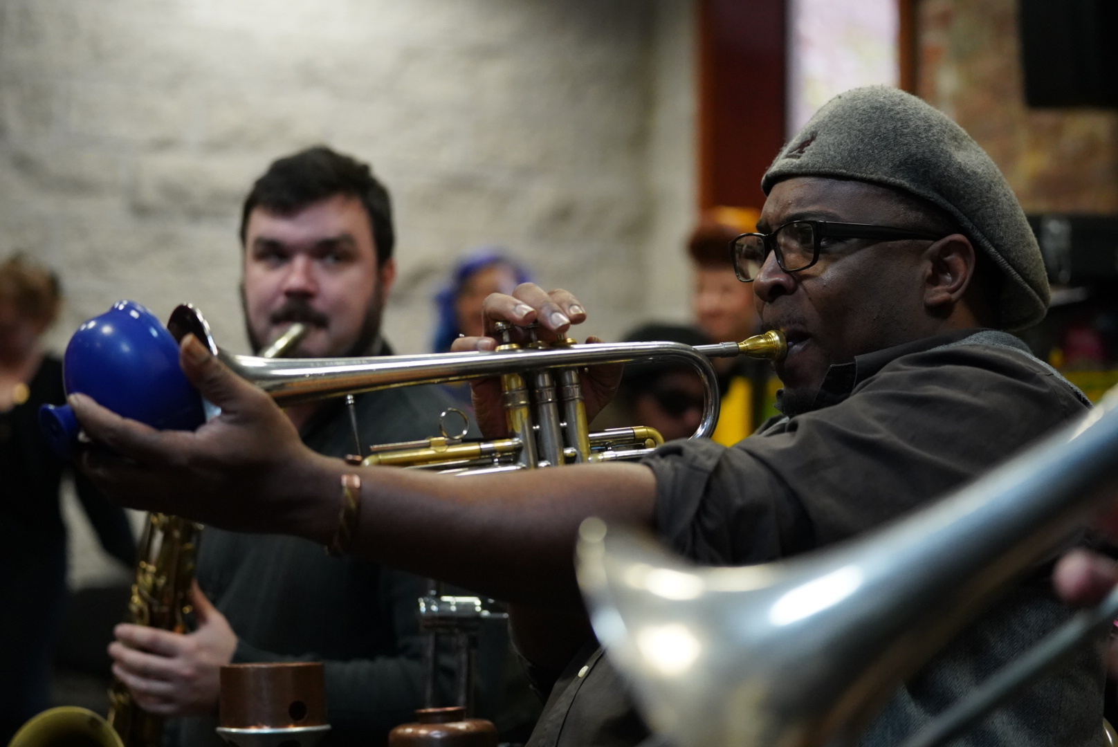 A trumpet player in full flow during a live set