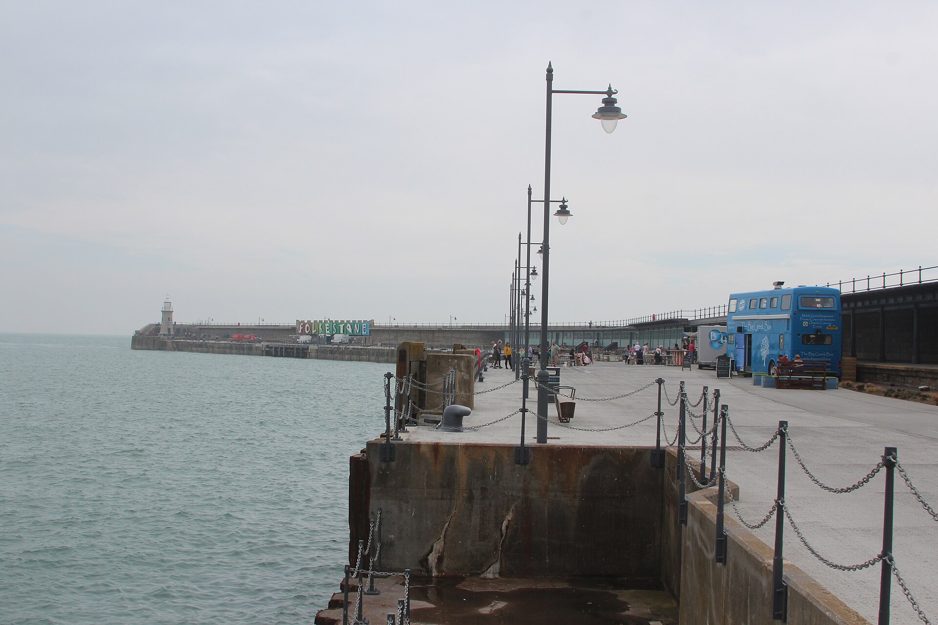 Folkestone Harbour Arm promenade stretching into the Channel