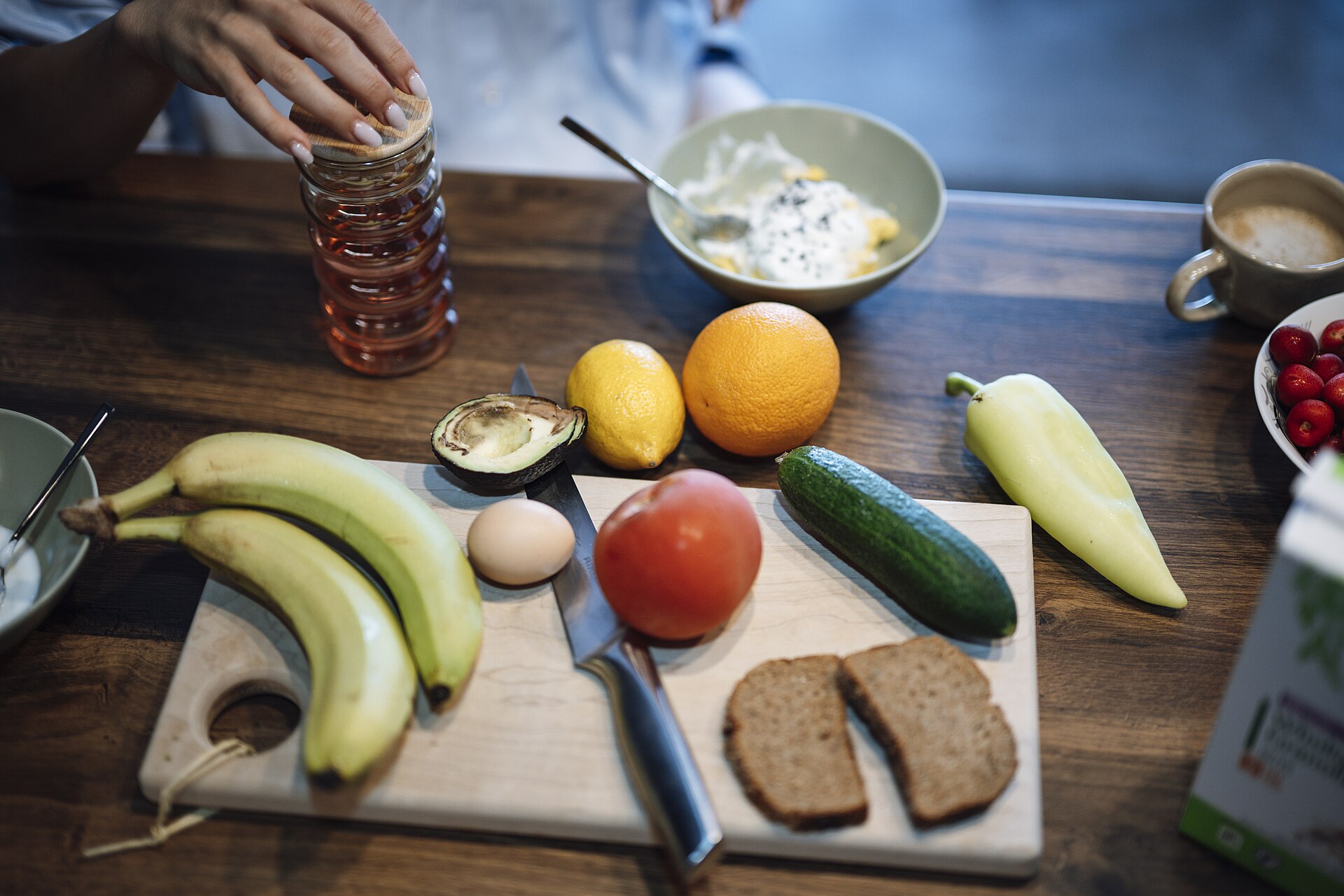 A fibre-rich breakfast spread of fruit and vegetables on a wooden table