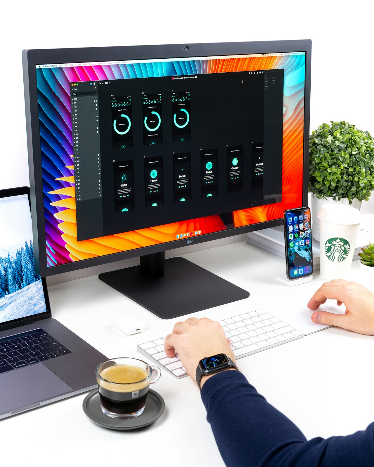 Home-office desk setup with external monitor, keyboard and a person typing