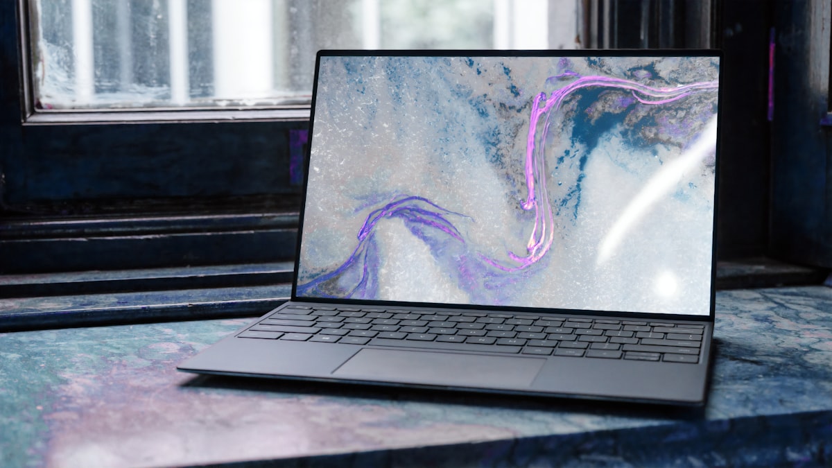 A laptop positioned beside a window to use natural daylight as the key light