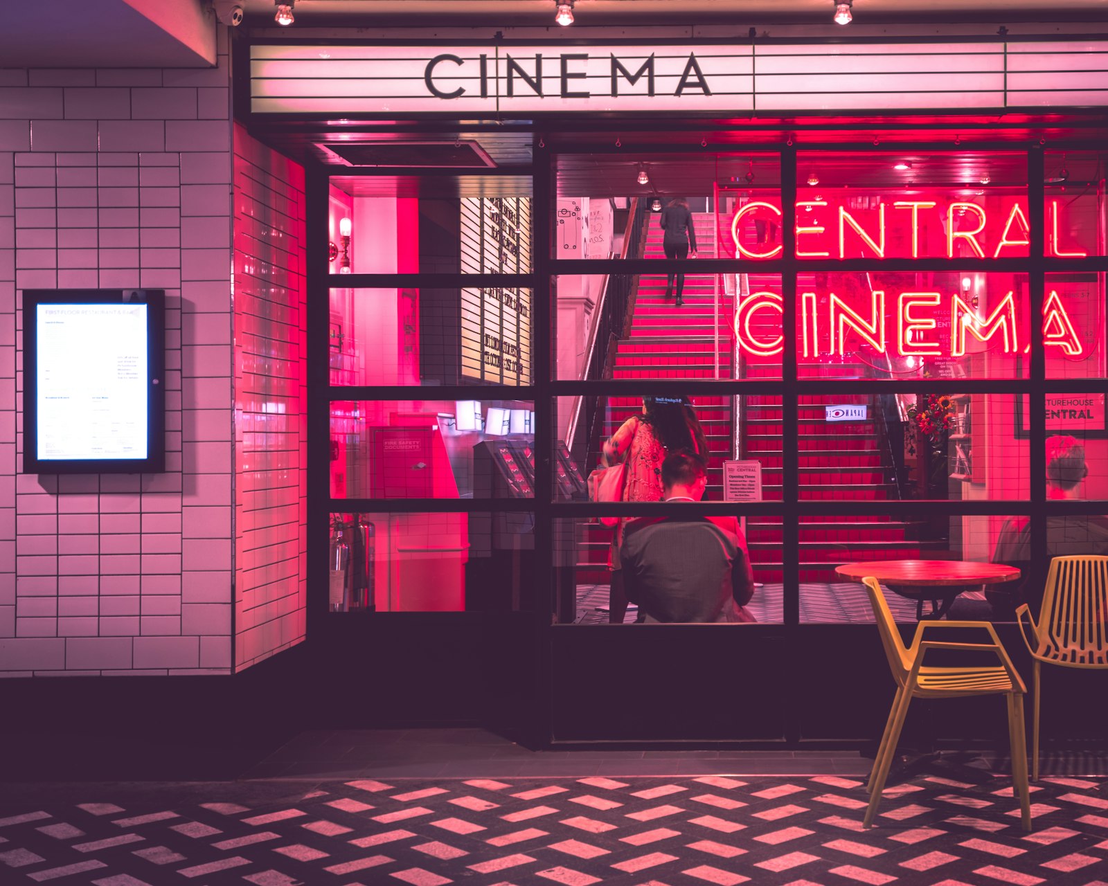 Independent cinema front lit in pink neon, the kind of venue Letterboxd 2026 culture has helped fill