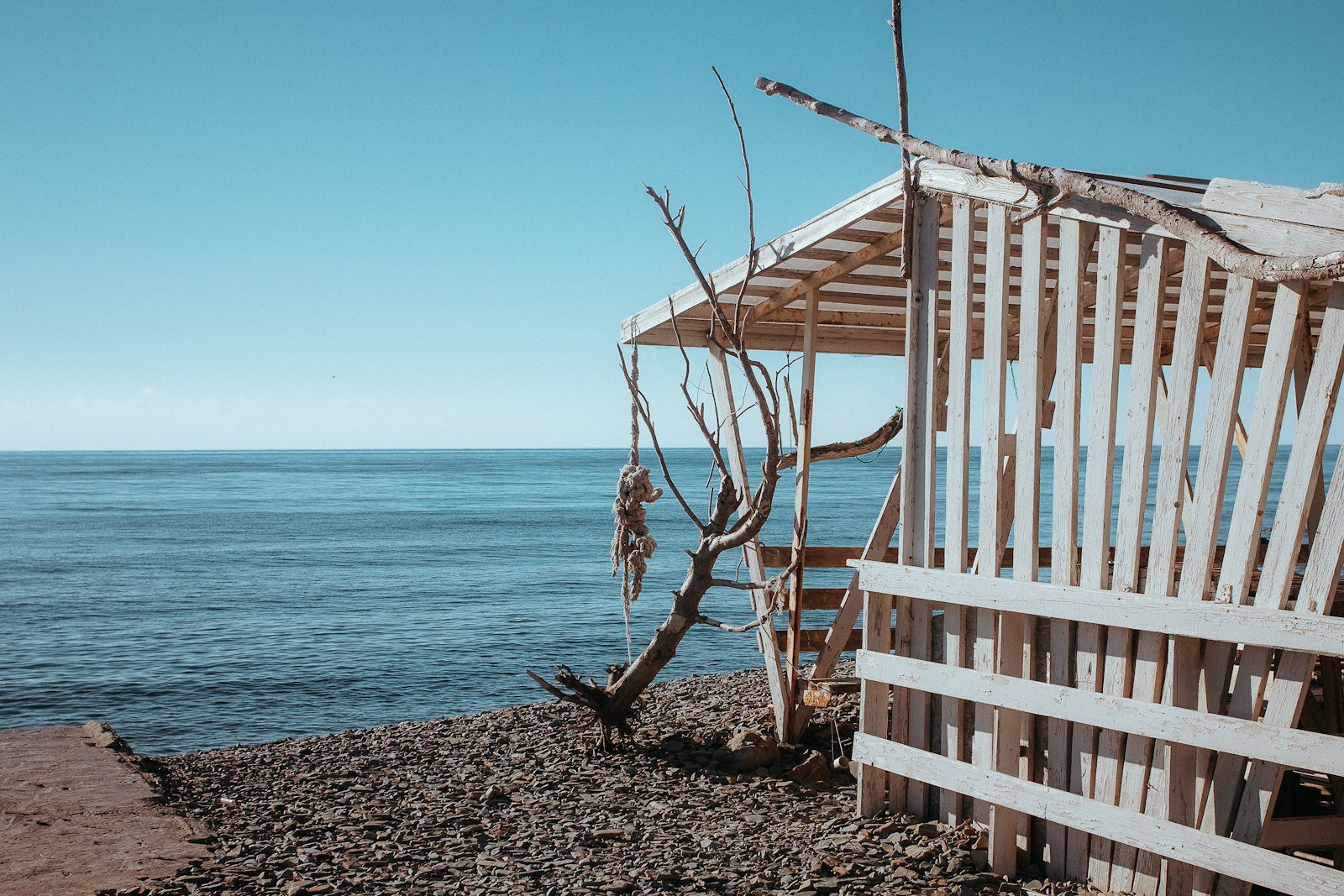 A wooden wild sauna cabin on a British beach beside the sea