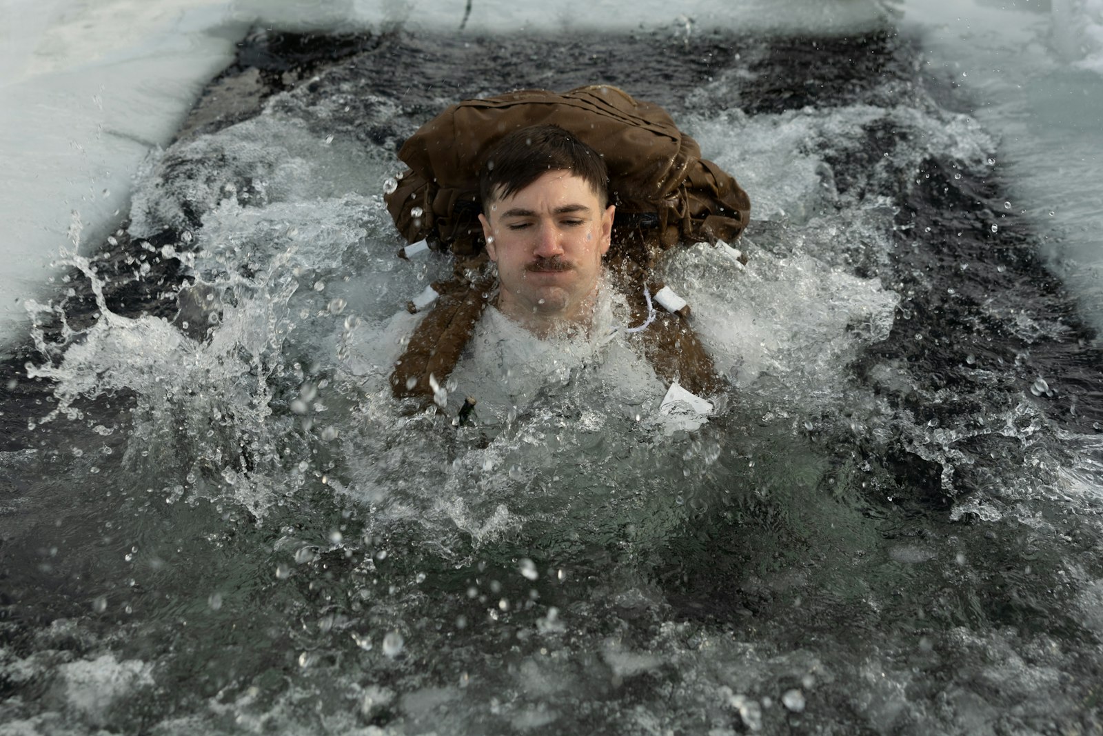 A swimmer emerging from cold open water after a sauna session