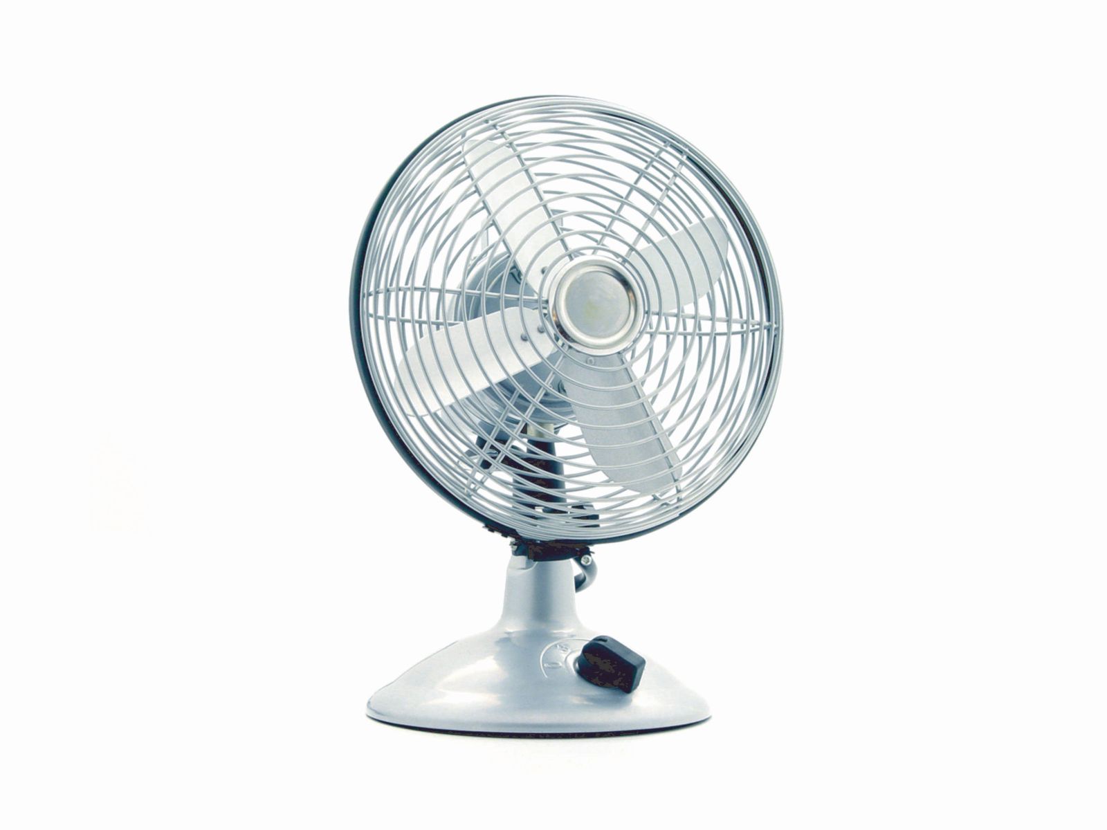 A white electric desk fan, the kind that helps with sleeping in a heatwave when the air stays below 35°C