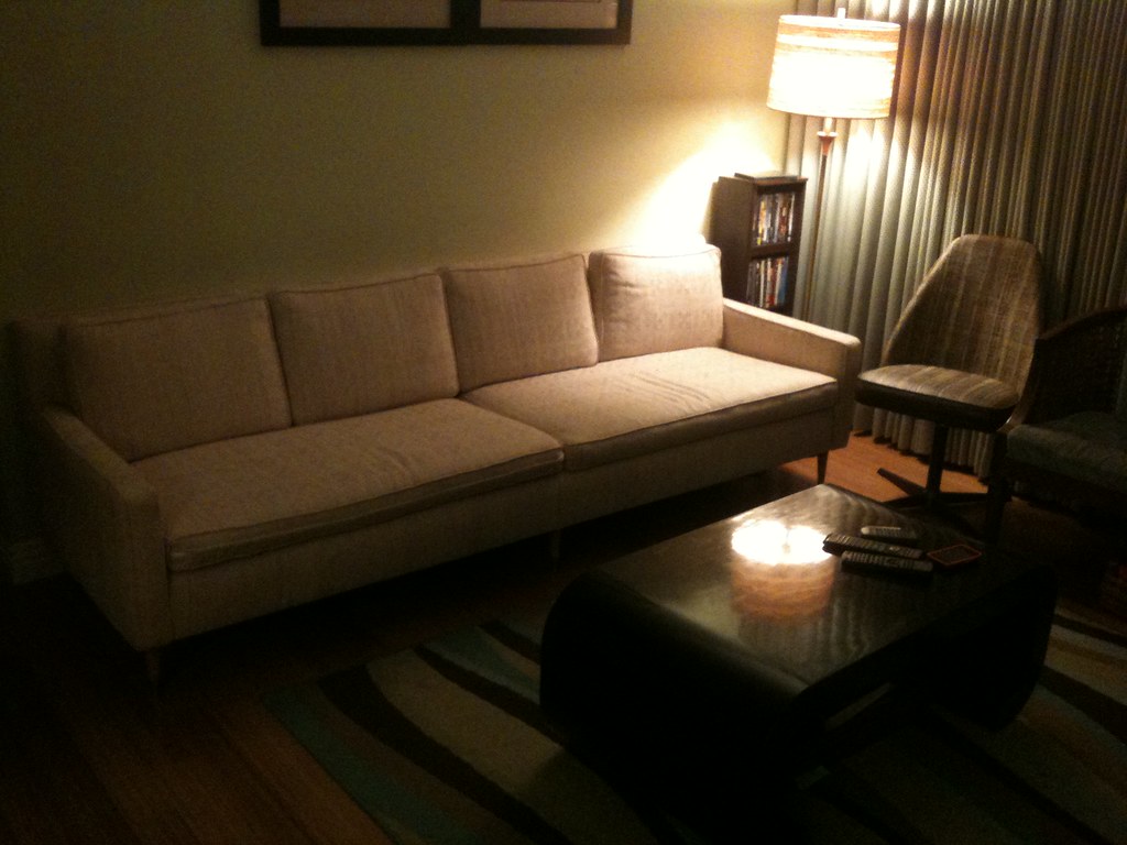 The modern sunken living room look swaps 70s tweed for low, soft seating